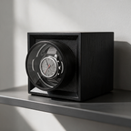 Solstane single watch winder on a minimalist studio shelf